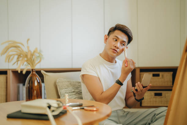 Non-binary gender person applying makeup