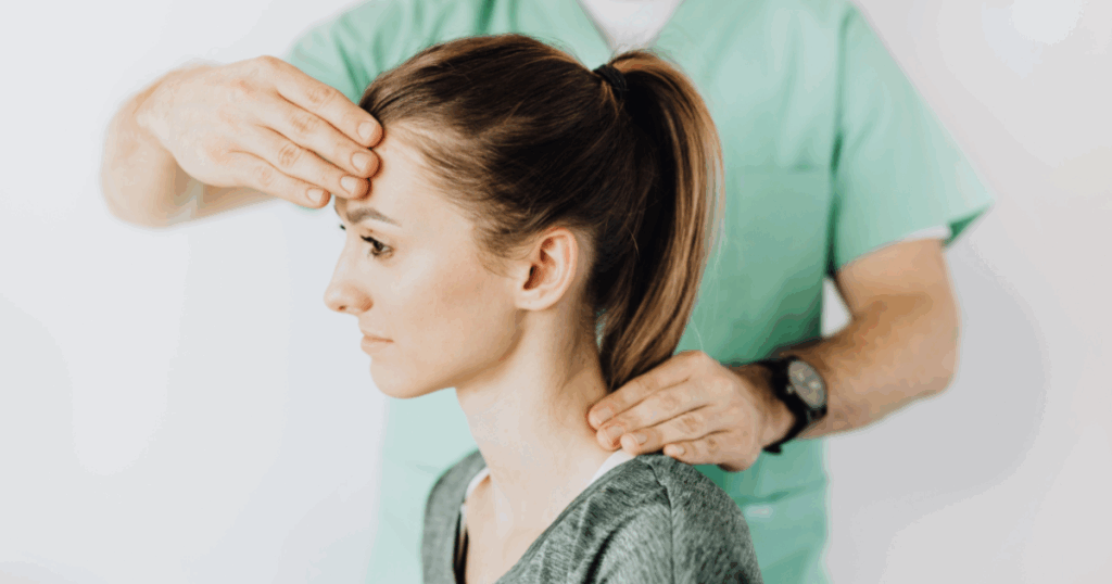 Chiropractic adjustment on a woman's neck